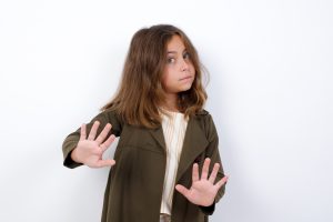 A little girl firmly tells someone to stop.
